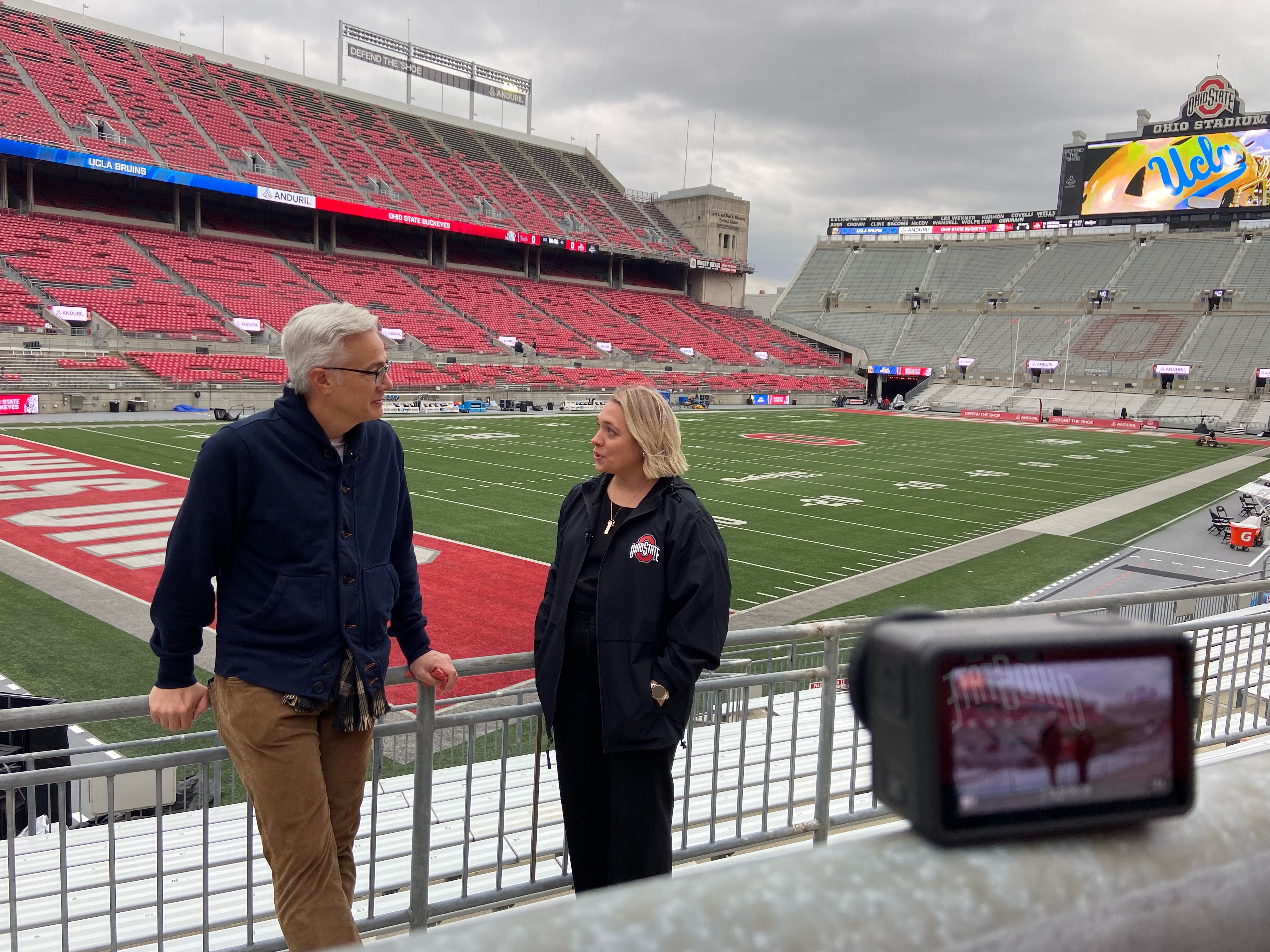 Mary Leciejewski talking with a CBS News reporter at Ohio Stadium.