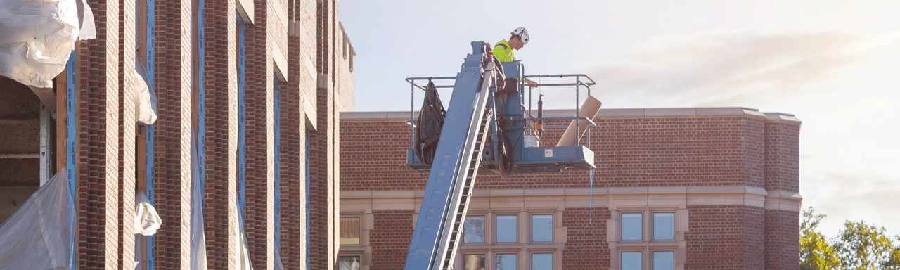 Image of a construction worker on a lift