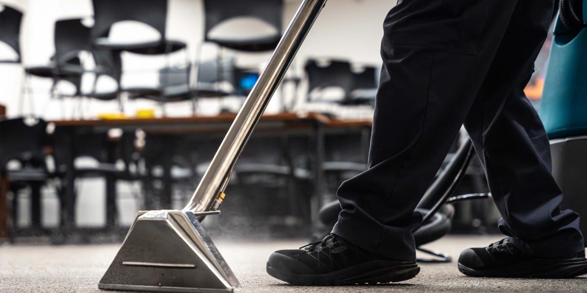 A close-up photo of a vacuum on the carpet.