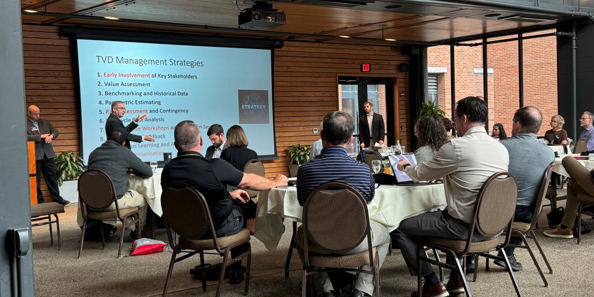 group of people listening to a presentation