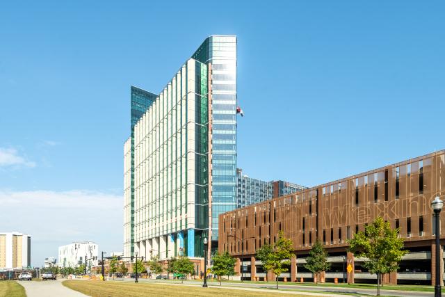 An exterior view of the inpatient hospital. The parking garage is on the right.