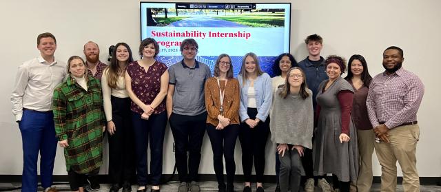 Interns and FOD personell pose for a photo before their presentation for FOD administrators.