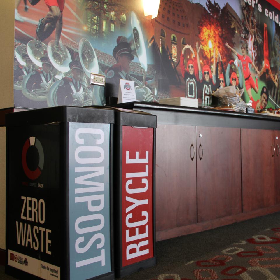 A compost can and recycle can in a suite at Ohio Stadium.