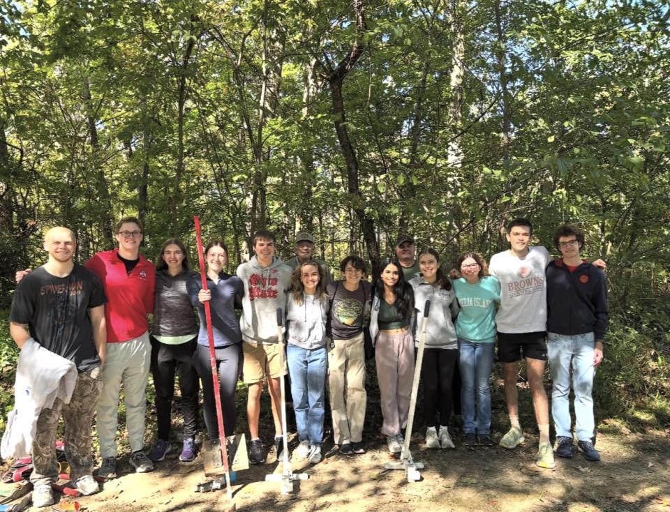 Students gather, smiling.