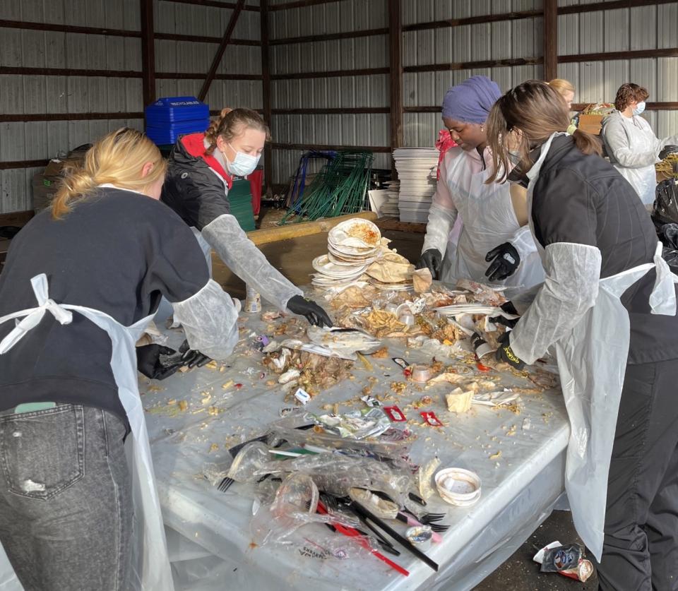Students sorting waste and collecting comparison data.